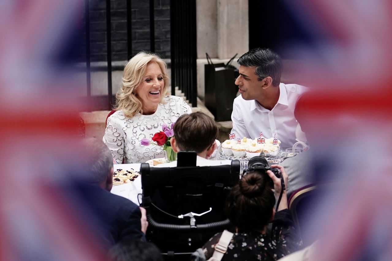 US first lady Jill Biden and British Prime Minister Rishi Sunak speak during a "Coronation Big Lunch" event on Downing Street.
