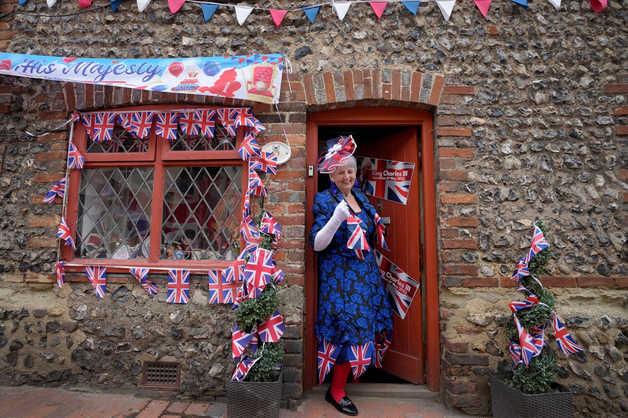 Sylvia Daw leaves her cottage to celebrate in Alfriston, England.