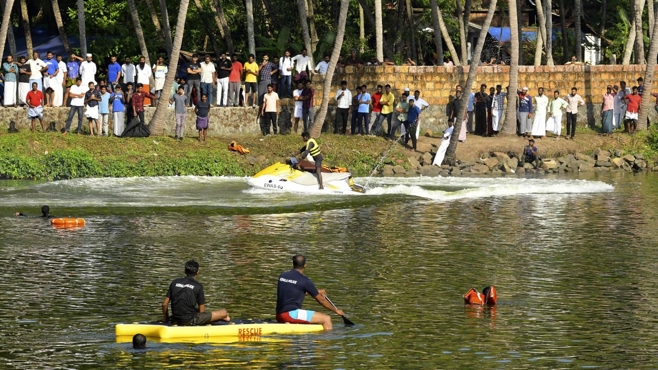 Rescuers carry out search operations on Monday, May 8, after a tourist boat capsized in Malappuram, Kerala, India.