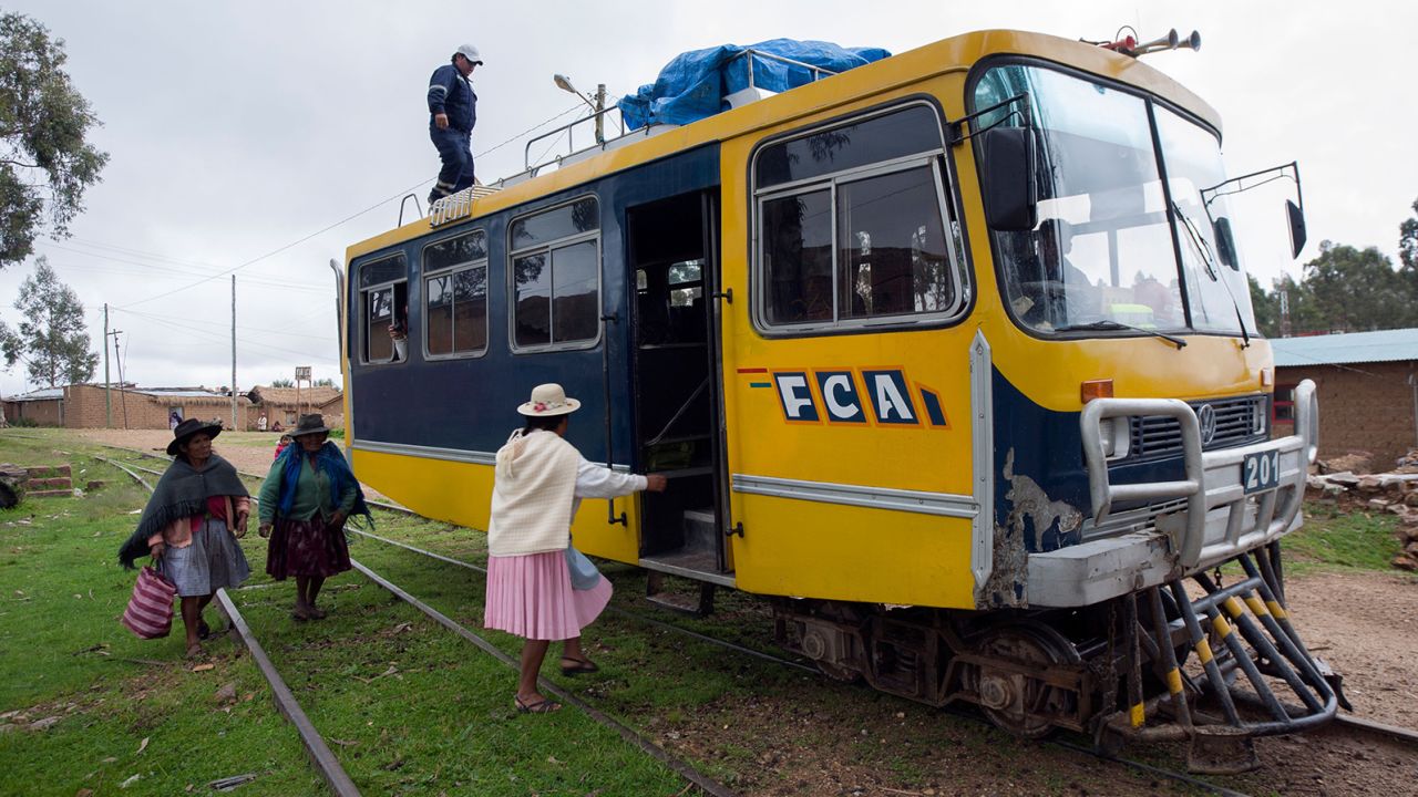 Wome getting on a Ferrobus along the Potosi-Sucre route in Bolivia. 