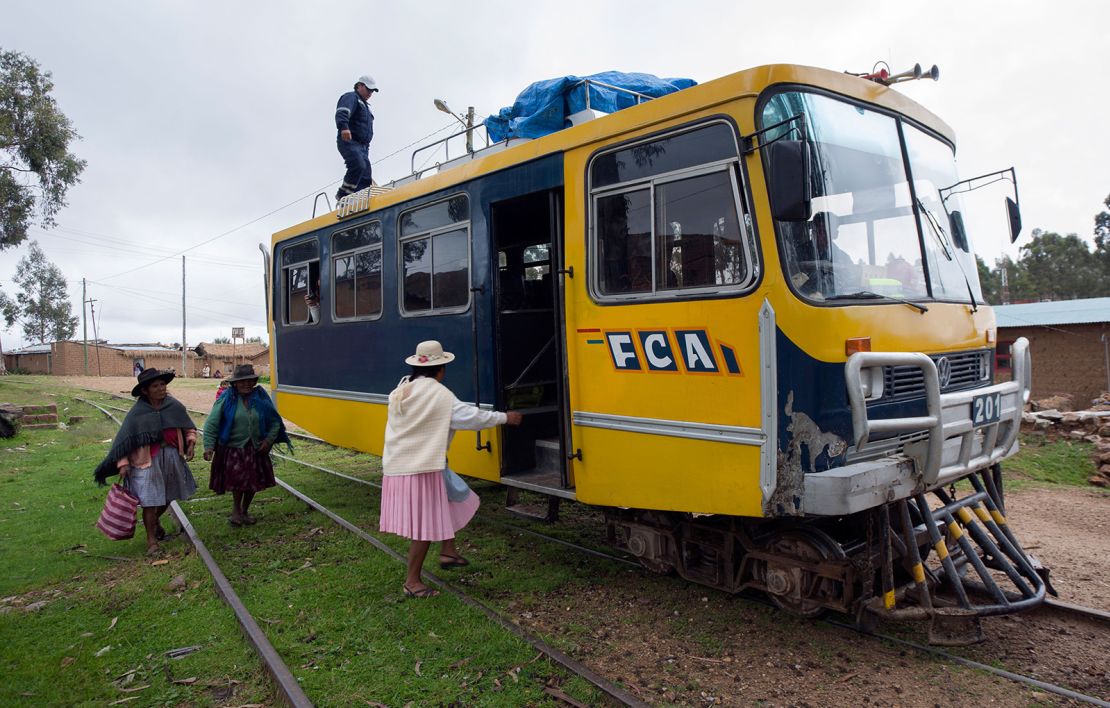 Wome getting on a Ferrobus along the Potosi-Sucre route in Bolivia. 