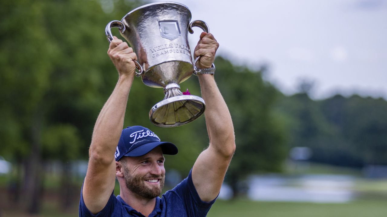 Wyndham Clark raises the Wells Fargo Championship Trophy after winning at Quail Hollow Club in Charlotte, North Carolina.