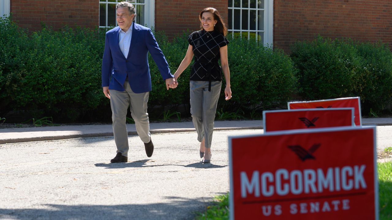 Then-Republican Senatorial candidate David McCormick and his wife Dina Powell McCormick heads to vote at his polling location on the campus of Chatham University on May 17, 2022 in Pittsburgh, Pennsylvania.
