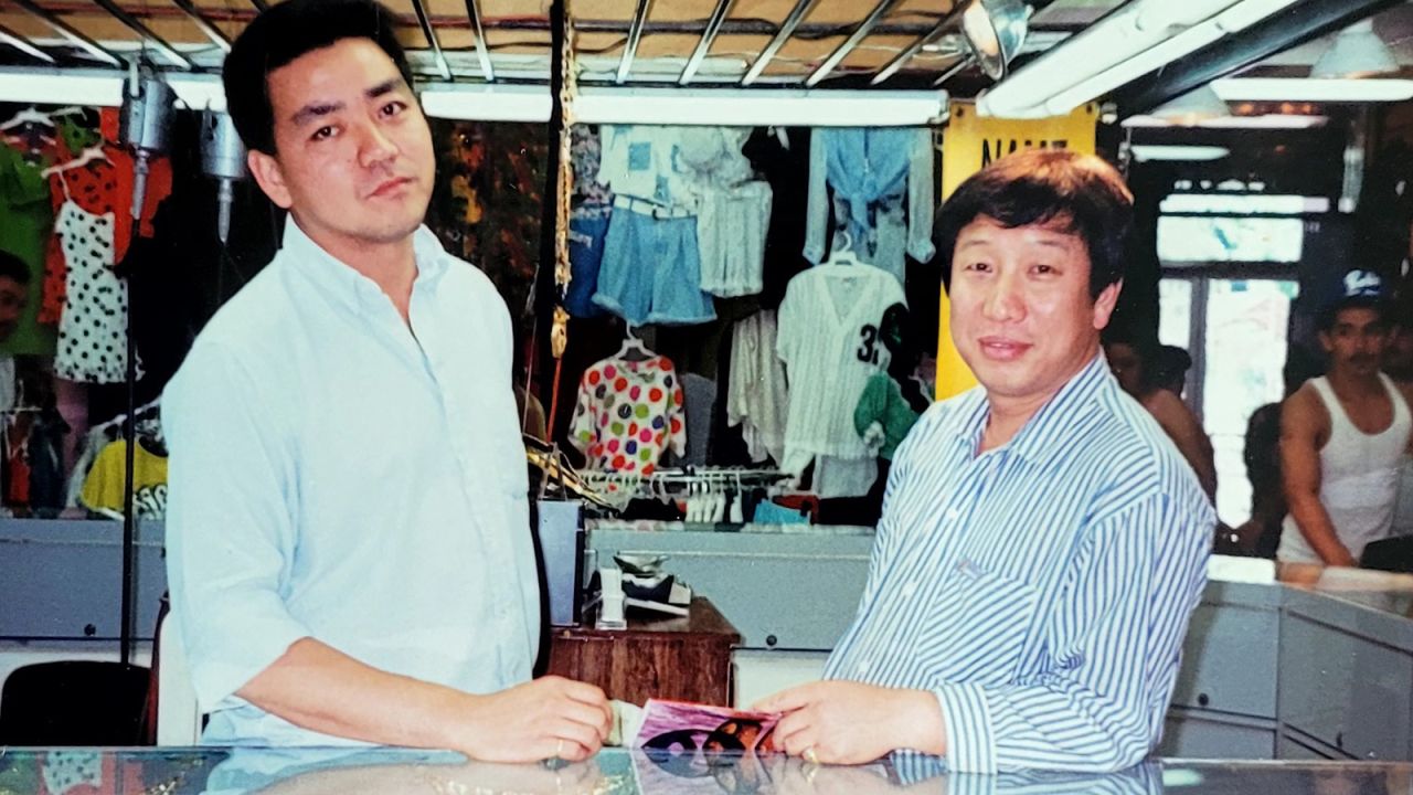 Kim Moon-kuk (right) in Los Angeles in 1992, the year of the deadly LA riots. In the absence of LA police, Kim defended his store, which was damaged but not looted or burned like many other Koreatown stores.