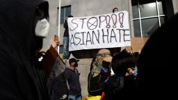 SAN FRANCISCO, CALIFORNIA - MARCH 22: Protesters hold a sign during a rally in solidarity with Asian hate crime victims outside of the San Francisco Hall of Justice on March 22, 2021 in San Francisco, California. Hundreds of people rallied in support of the family of Vichar Ratanapakdee, a Thai immigrant who died following an assault in downtown San Francisco. Violent crimes against the Asian community in the San Francisco Bay Area are on the rise. (Photo by Justin Sullivan/Getty Images)