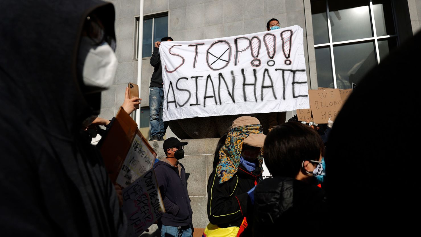 Protesters hold a sign during a rally in solidarity with Asian hate crime victims outside of the San Francisco Hall of Justice on March 22, 2021.