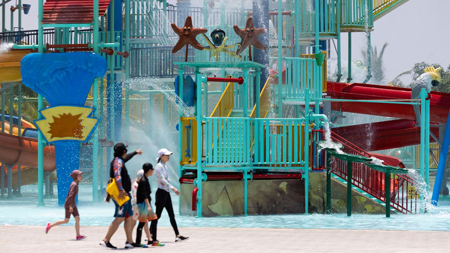 Visitors cool off at an amusement park in Hoi An, Vietnam. The country marked its hottest day ever Saturday.  