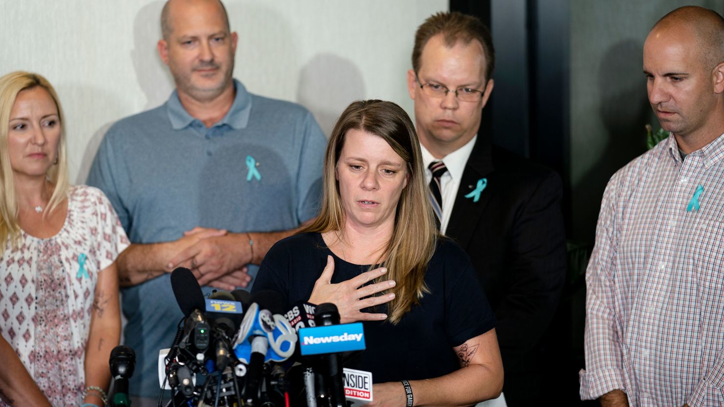 Nichole Schmidt, mother of Gabby Petito, whose death on a cross-country trip sparked a manhunt for her fiance Brian Laundrie, speaks alongside, from left, Tara Petito, stepmother, Joseph Petito, father, Richard Stafford, family attorney, and Jim Schmidt, stepfather, during a news conference in 2021. 