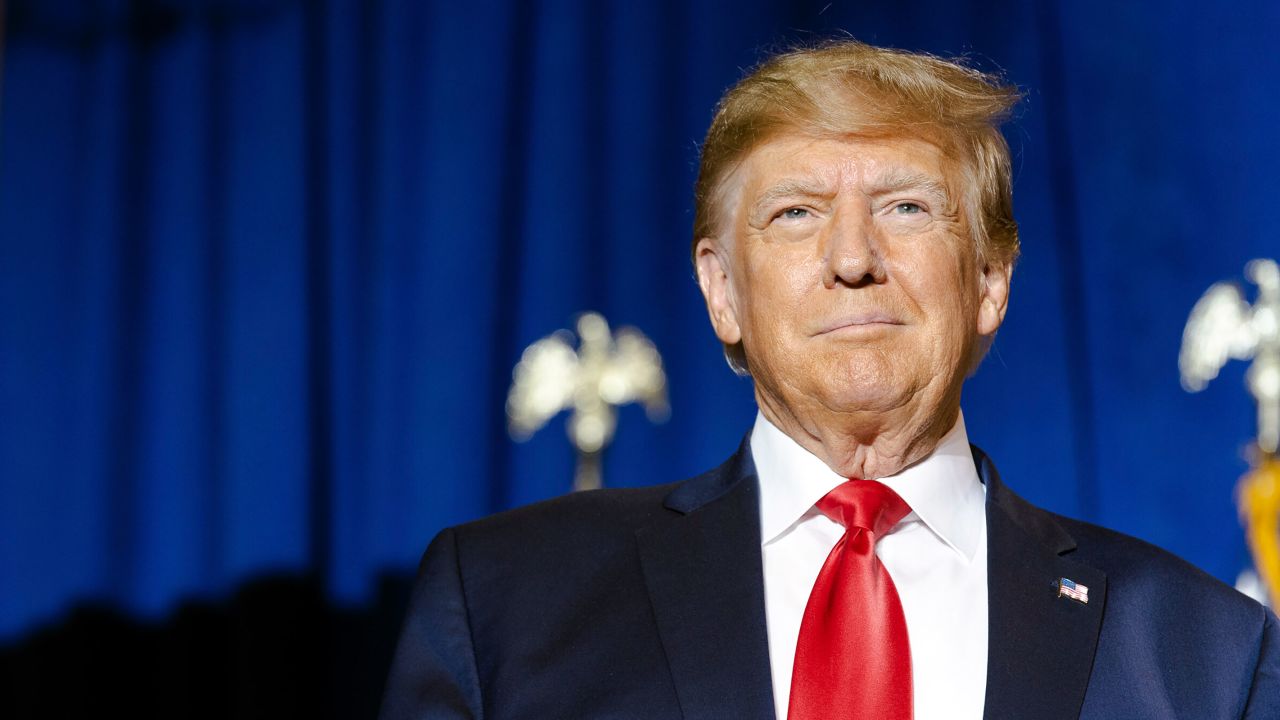 Former President Donald Trump walks on stage to speak at a campaign rally in Manchester, New Hampshire, on April 27.