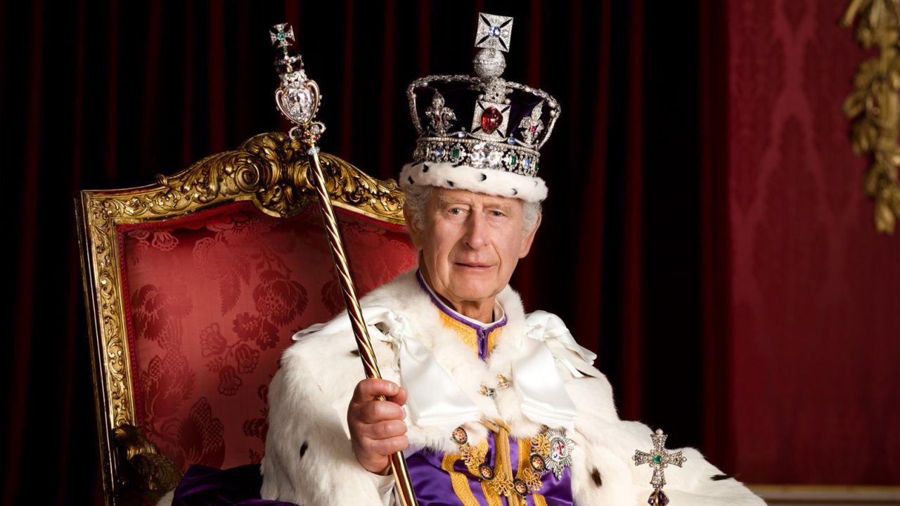 In this photo made available by Buckingham Palace on Monday, May 8, 2023, Britain's King Charles III poses for a photo in full regalia in the Throne Room, London. 