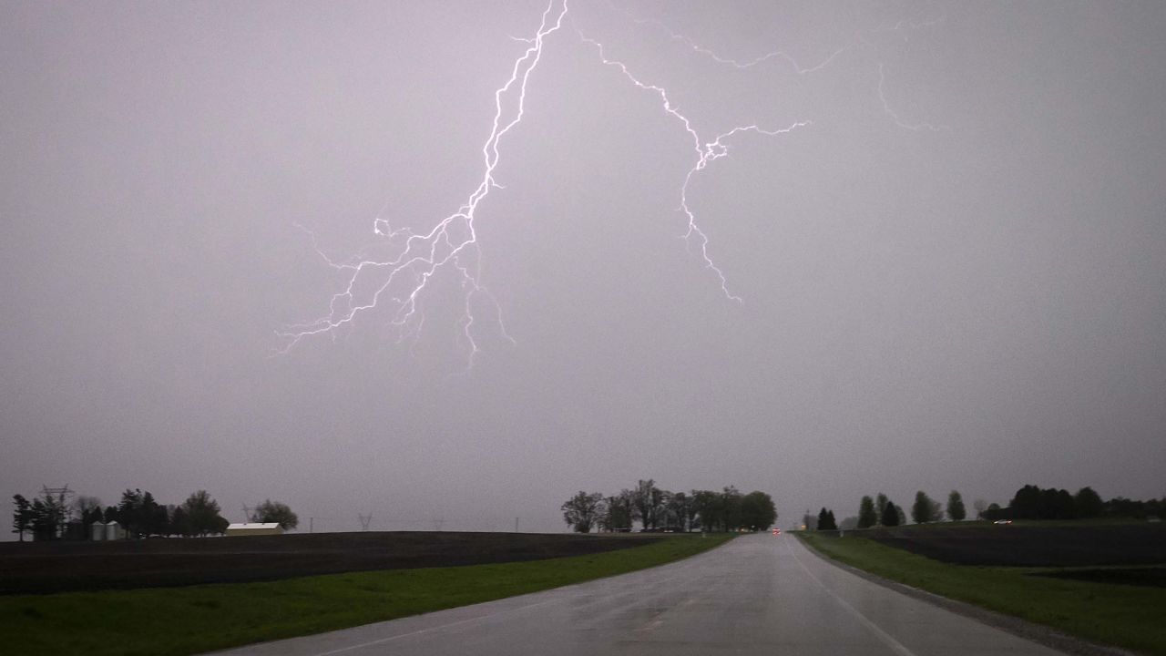 Lightning streaks across the sky Sunday during a severe thunderstorm near Lone Tree, Iowa.