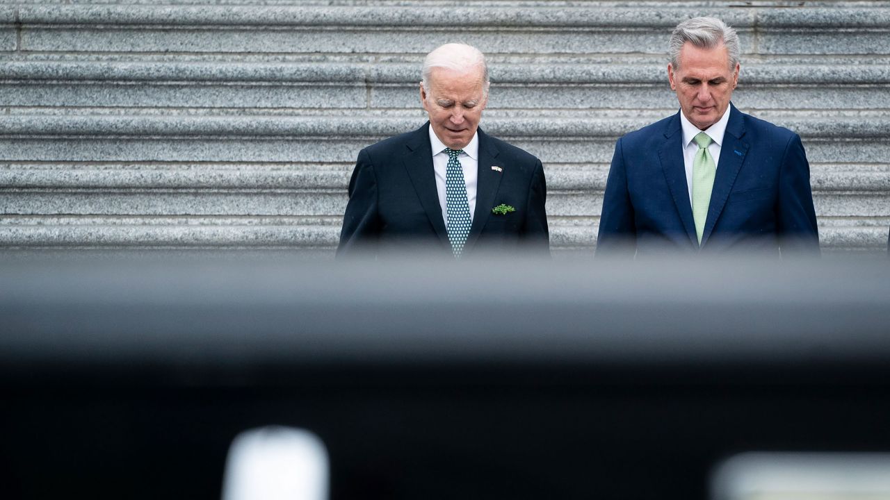 President Joe Biden walks with House Speaker Kevin McCarthy as he departs following the annual St. Patrick's Day luncheon on Capitol Hill on Friday, March 17, in Washington, DC. 
