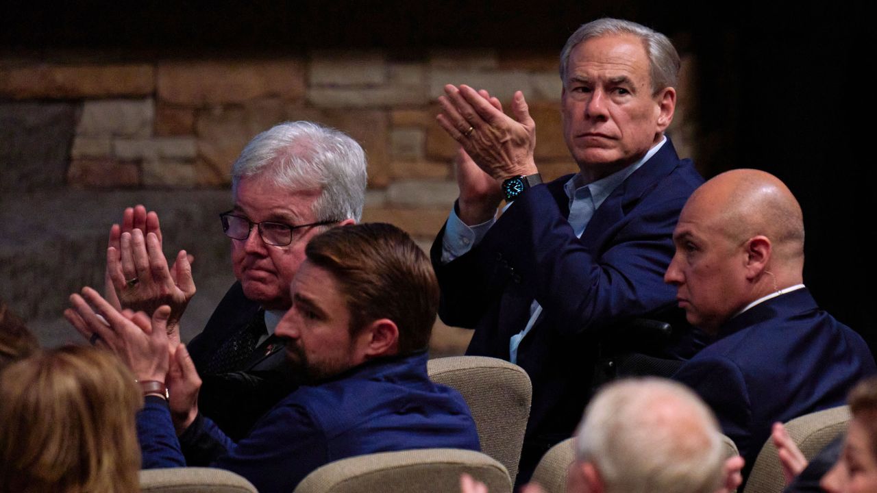 Texas Gov. Greg Abbott, top right, attends a vigil at Cottonwood Creek Church in Allen, Texas, for the victims of a shooting the day before at Allen Premium Outlets on Sunday, May 7.