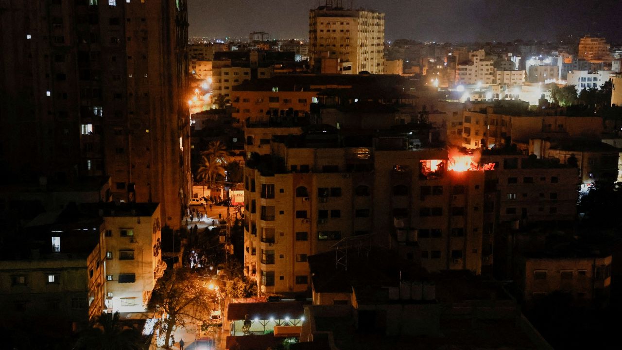 A fire burns in a building after the Israeli military struck Islamic Jihad targets, it said in a statement, in Gaza, on May 9.