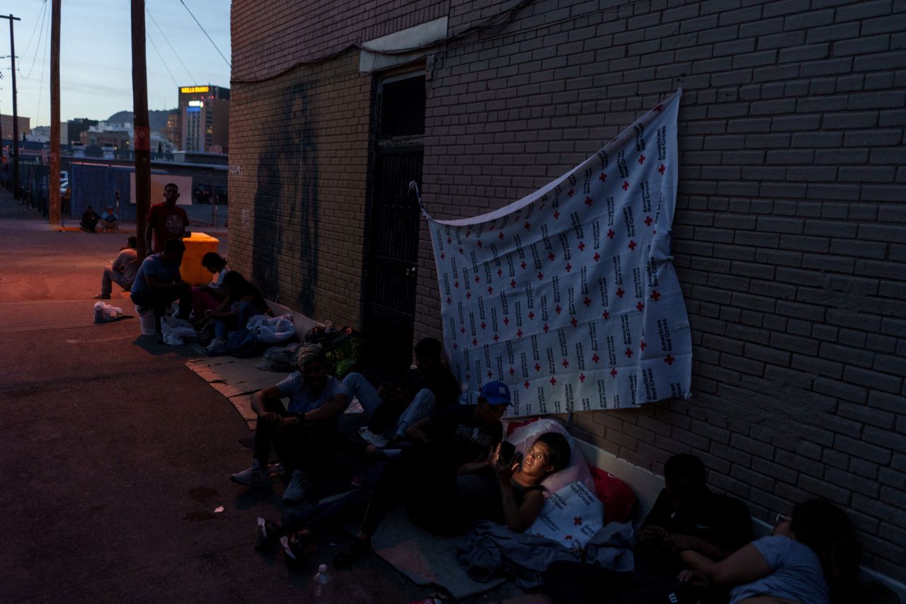 Migrants camp out in an alley behind the Sacred Heart Church in downtown El Paso on April 30.