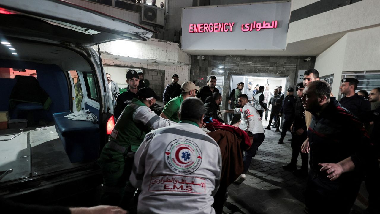 Medics transport a victim to Shifa Hospital following the deadly Israeli airstrikes launched into Gaza on Tuesday.