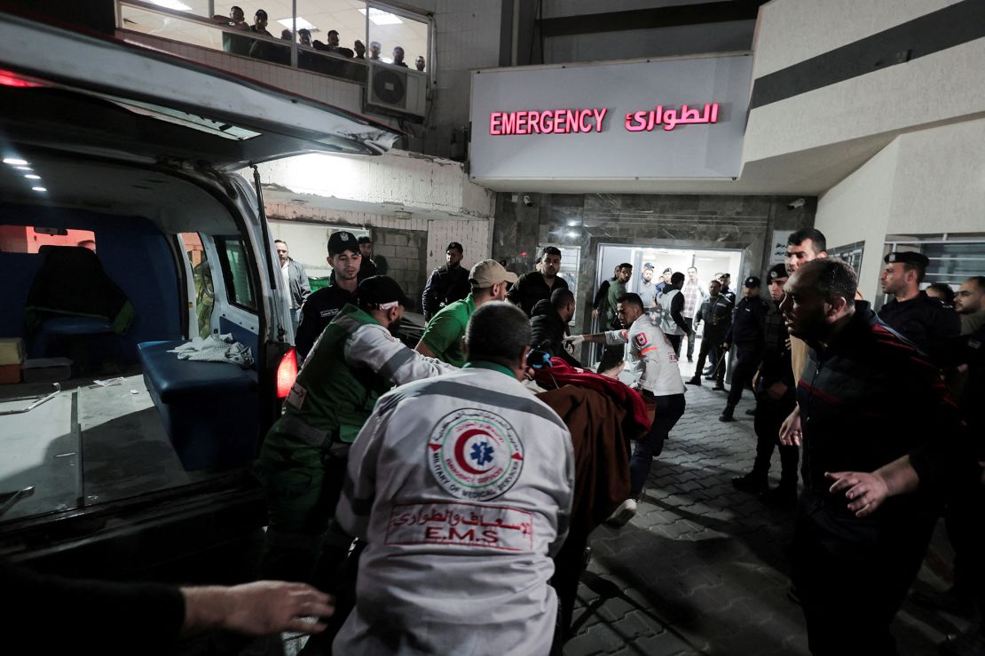 Medics transport a victim to Shifa Hospital following the deadly Israeli airstrikes launched into Gaza on Tuesday.