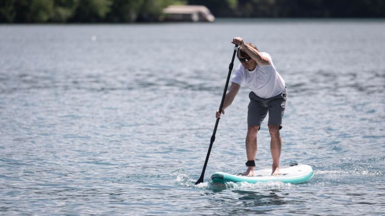 The board's integrated jet-powered motor allows people to paddle through waves and currents