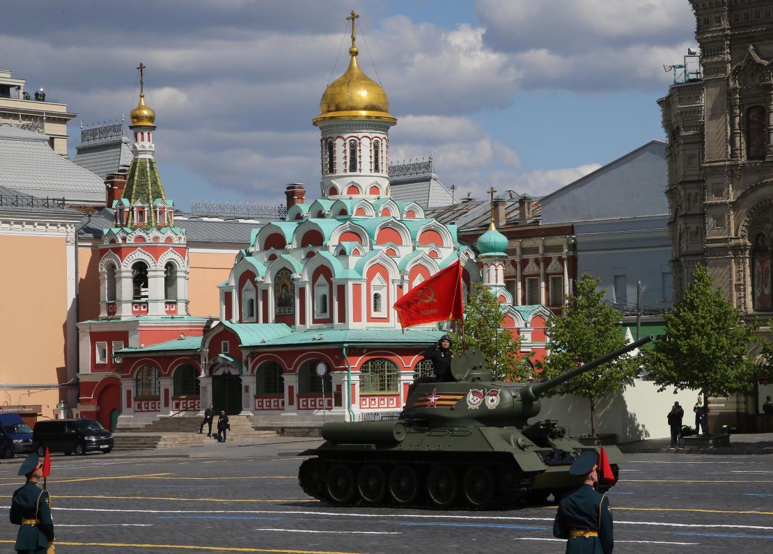 A lone Soviet-era T-34 tank leads the procession in Moscow in contrast to the large array of military hardware on display on previous Victory Day parades.