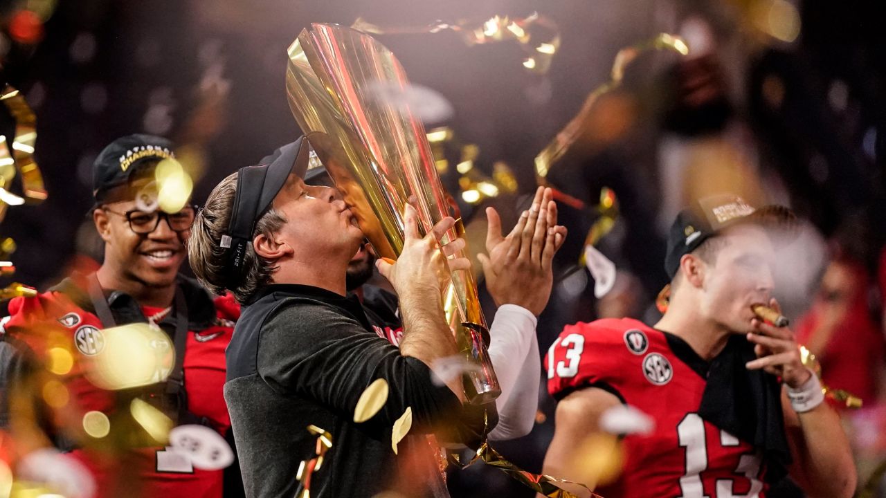 Georgia head coach Kirby Smart kisses the championship trophy after the national championship NCAA College Football Playoff game against TCU, Monday, Jan. 9, 2023, in Inglewood, Calif. Georgia won 65-7. 
