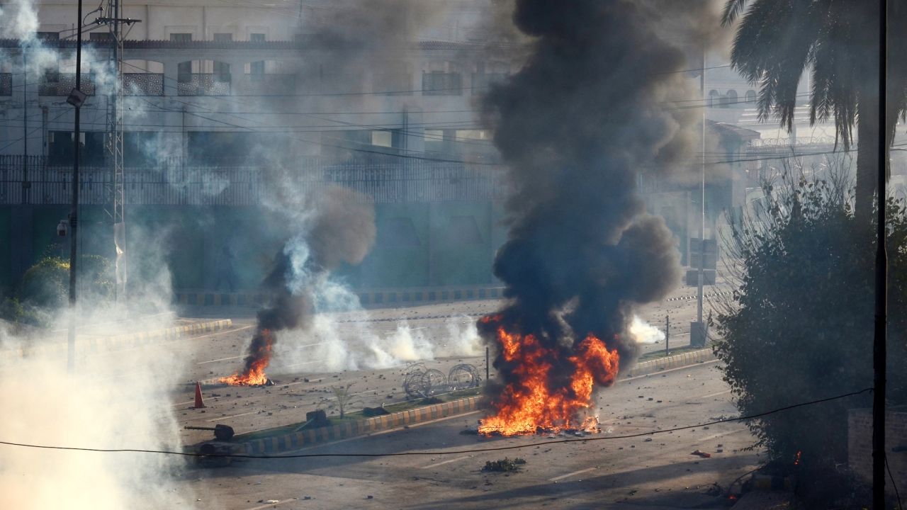 Imran Khan's supporters burn tires to block roads  in Peshawar, Pakistan on May 9, 2023.
