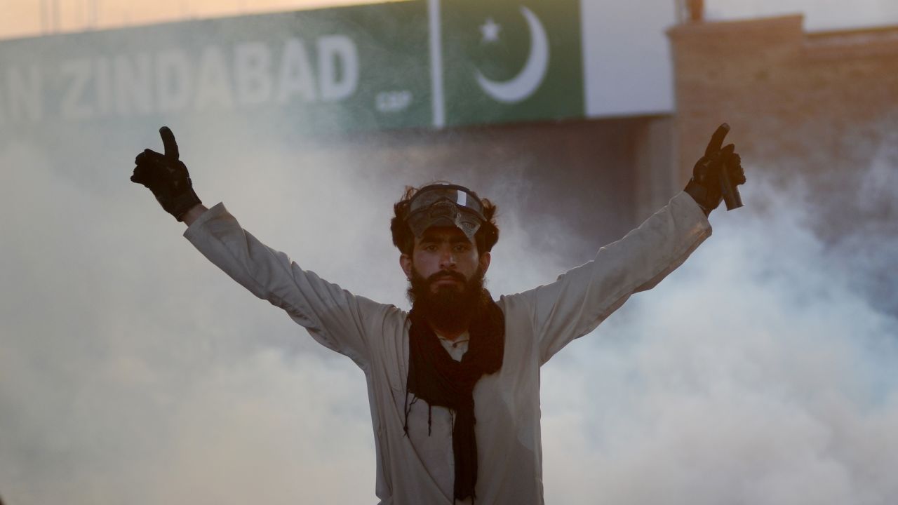 A demonstrator is seen as Pakistani police use tear gas against supporters of former Prime Minister Imran Khan during a protest in Peshawar, Pakistan on May 9, 2023.