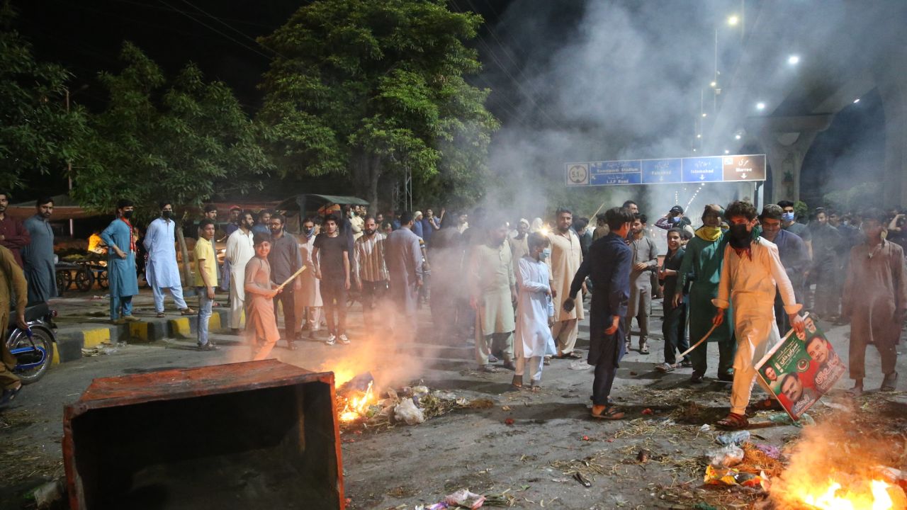 Protesters burn tires to block roads in Peshawar, Pakistan on May 9, 2023 following the dramatic arrest of Imran Khan.