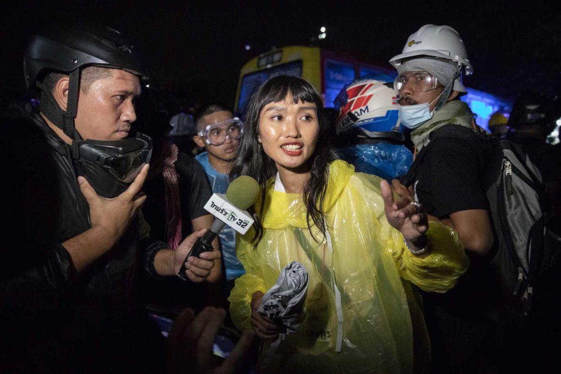 Protest leader, Chonthicha Jangrew, speaks to media as pro-democracy protesters and student activists march to The Grand Palace on November 8, 2020 in Bangkok, Thailand.  