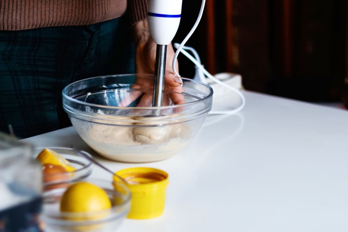 Make your dressing with a blender or food processor to emulsify the oil evenly with the acid.