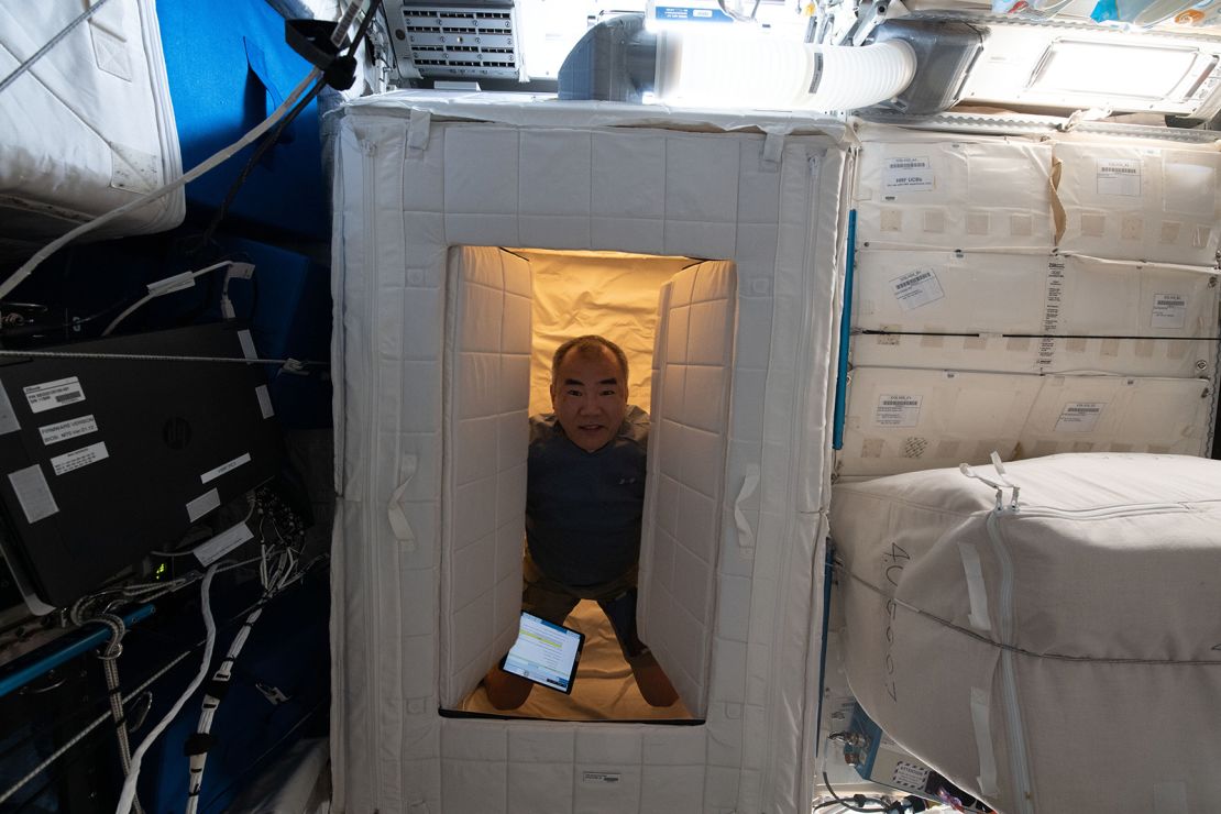 Former Japan Aerospace Exploration Agency astronaut Soichi Noguchi is inside a sleep station on the space station in April 2021.