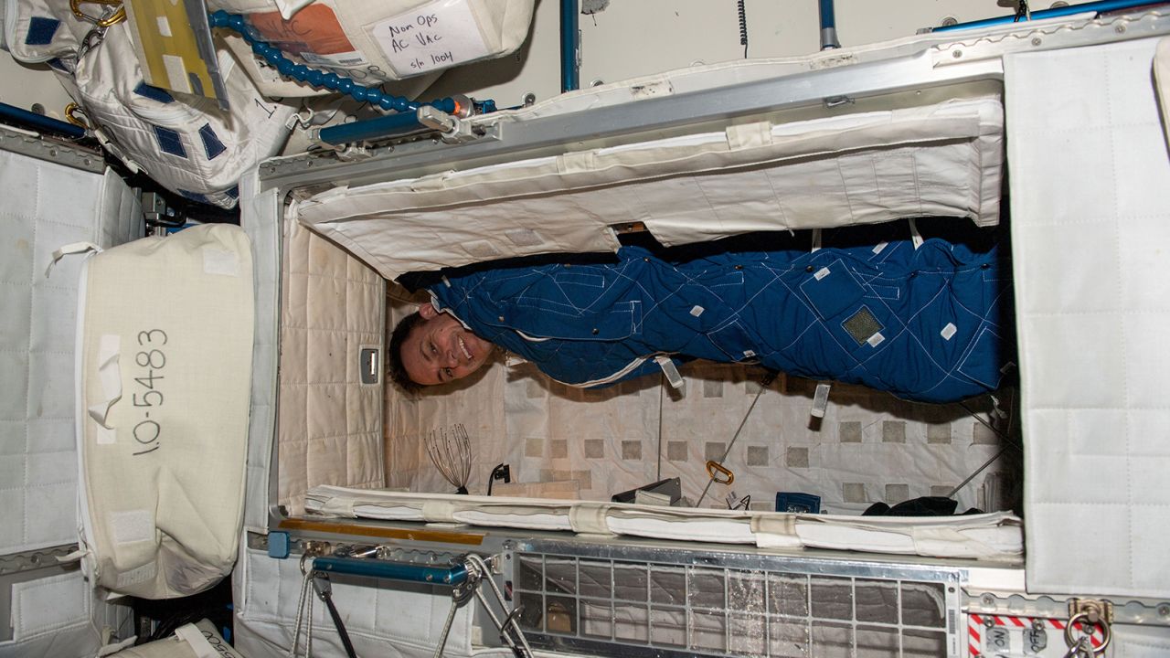 NASA astronaut Josh Cassada is bundled up in his crew quarters on the International Space Station on March 2. 