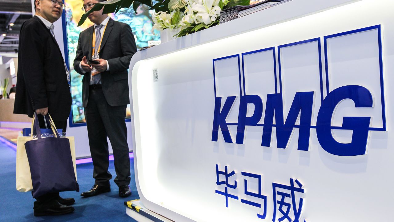 SHANGHAI, CHINA - NOVEMBER 09: People visit the KPMG booth on day five of the 2nd China International Import Expo (CIIE) at the National Exhibition and Convention Center on November 9, 2019 in Shanghai, China. The 2nd China International Import Expo (CIIE) is held in Shanghai on November 5-10.