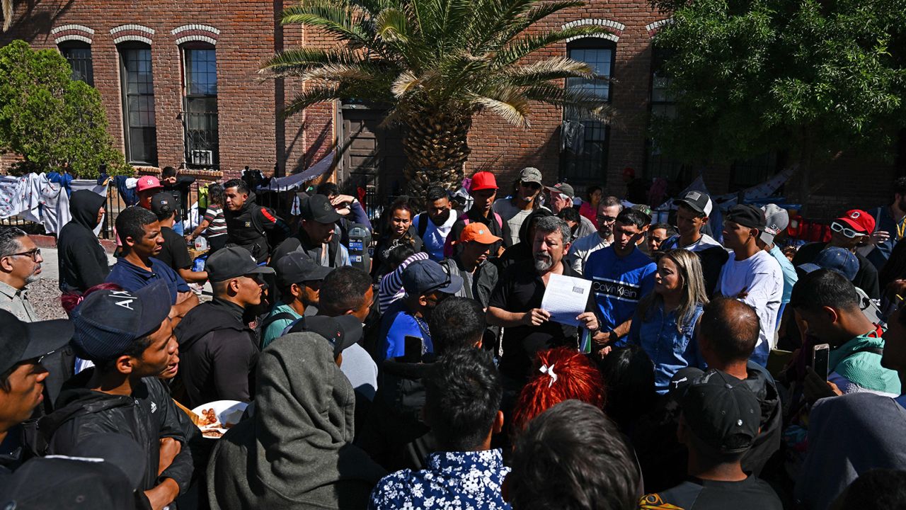 Fernando Garcia, executive director of the Border Network For Human Rights, speaks to migrants about their rights outside of the Sacred Heart Church in El Paso, Texas, on Tuesday.