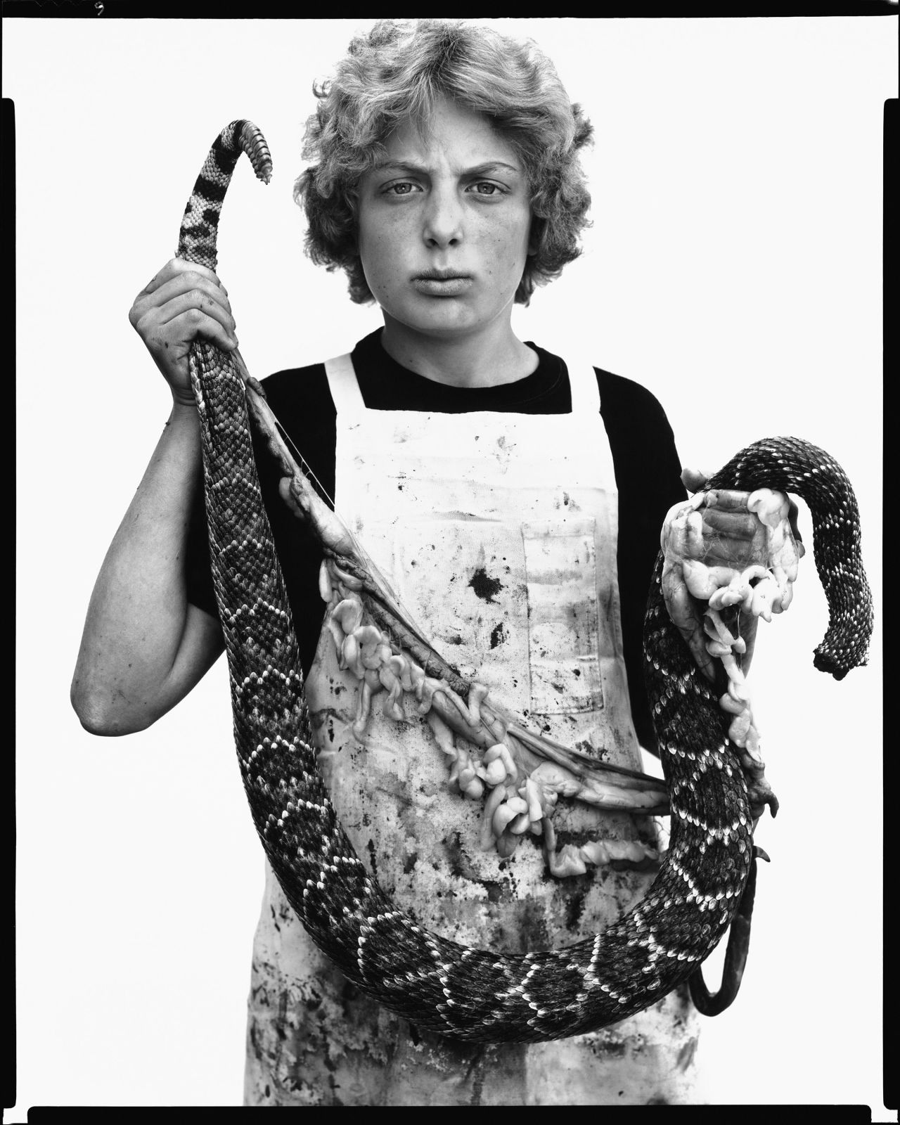 Fashion designer Miuccia Prada selected this image of Boyd Fortin, a teenaged rattlesnake skinner from Texas, taken in 1979. "The power of Richard Avedon's work for me is always in its study of humanity, its strengths and fragilities, sometimes raw but always honest," Prada said. "Avedon's work gave power and
value to people who often went unnoticed. He celebrated unanticipated beauty."