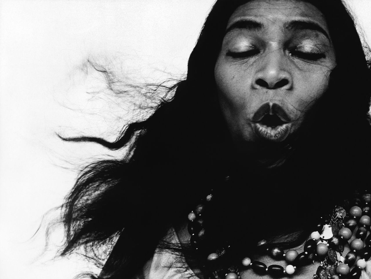 Gallerist and art critic Antwaun Sargent called this portrait of groundbreaking opera singer Marian Anderson "the image of Black virtuosic output." He continued: "The great American contralto Marian Anderson, eyes closed, midnote. She parts her lips, from which her operatic gift springs, to sing Avedon's camera a song. I like to imagine it is the emission of a single, perfect note from a hymn of rich, tremendous faith."