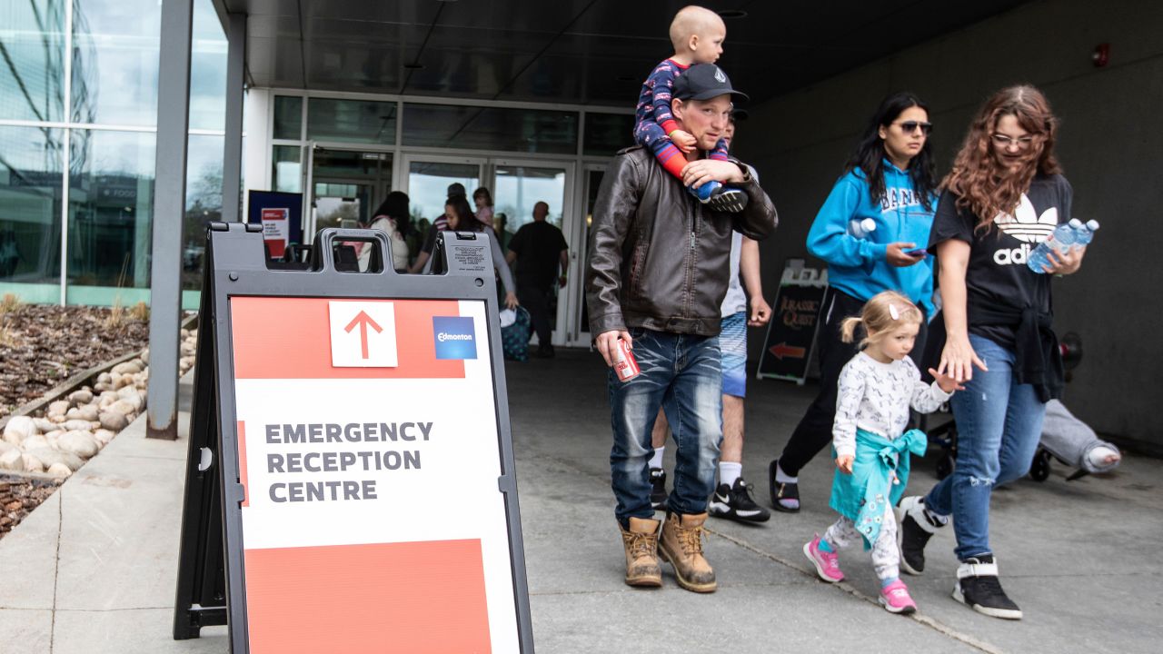 Wildfire evacuees get supplies and get checked in at the evacuation center in Edmonton, Alberta, Sunday, May 7, 2023.