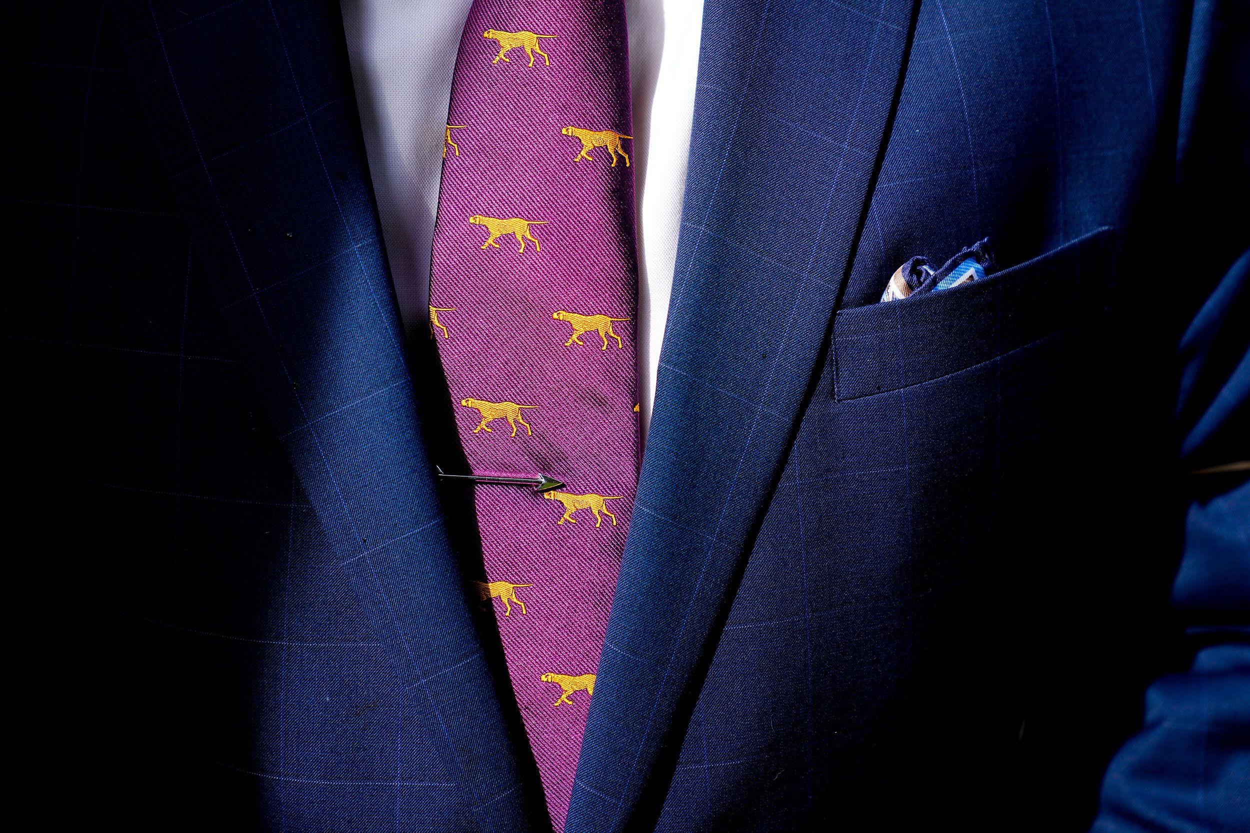 A handler wears a dog-themed tie on Monday.