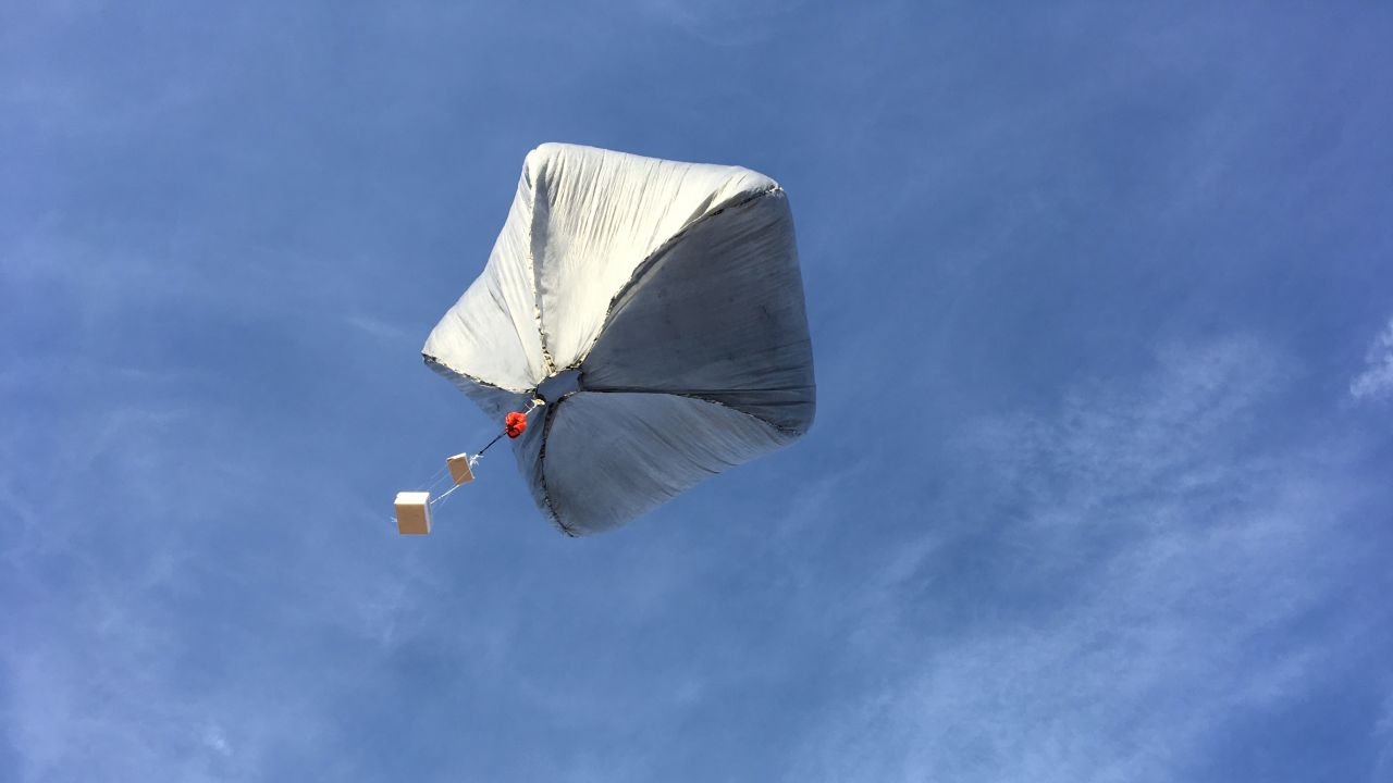 A Sandia National Laboratories solar-powered hot air balloon taking flight bears sensors, including a GPS tracker and reusable infrasound sensor. 