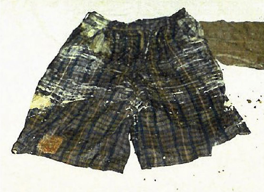 The woman in the well also wore dark plaid shorts.