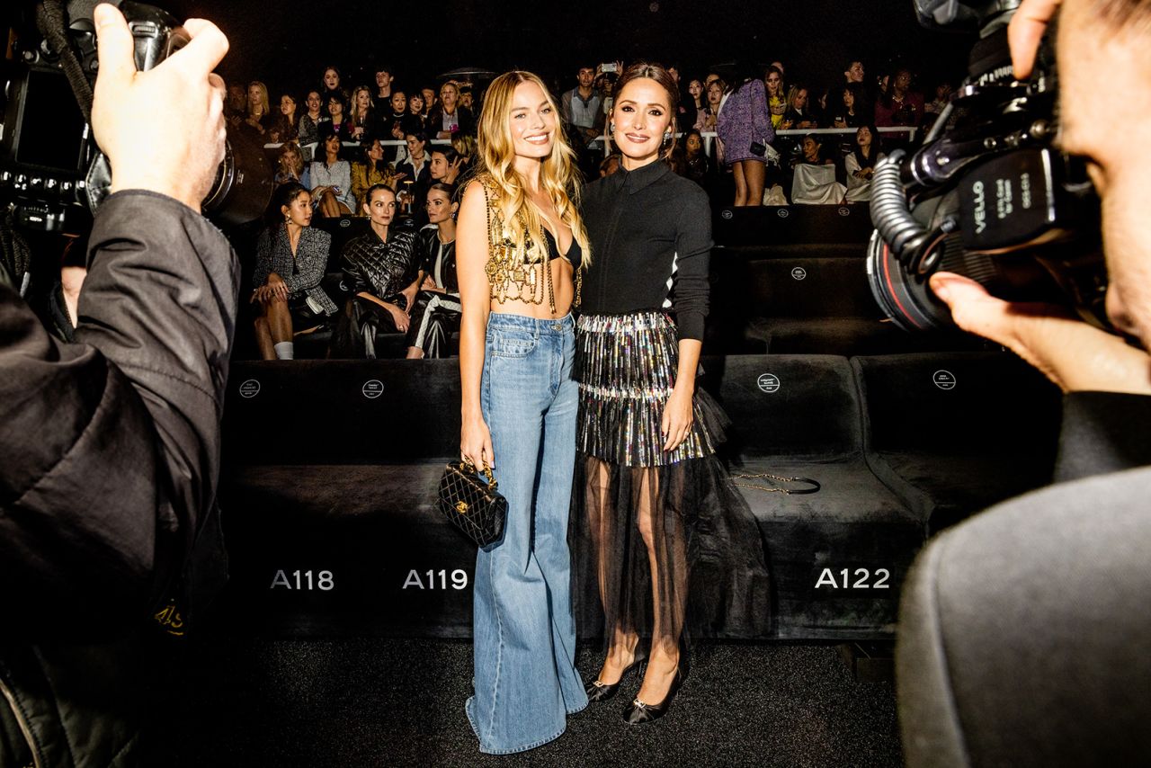 From left: Margot Robbie and Rose Byrne attend Chanel's 2023/24 Cruise show at Paramount Studios on May 9, 2023 in Los Angeles.