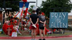 ALLEN, TEXAS - MAY 09:  People visit the memorial setup near the scene of a mass shooting at the Allen Premium Outlets mall on May 9, 2023 in Allen, Texas. Eight people were killed and seven wounded in the Saturday attack in which the gunman was killed by police, according to published reports. Three of the wounded are in critical condition, according to the reports. (Photo by Joe Raedle/Getty Images)