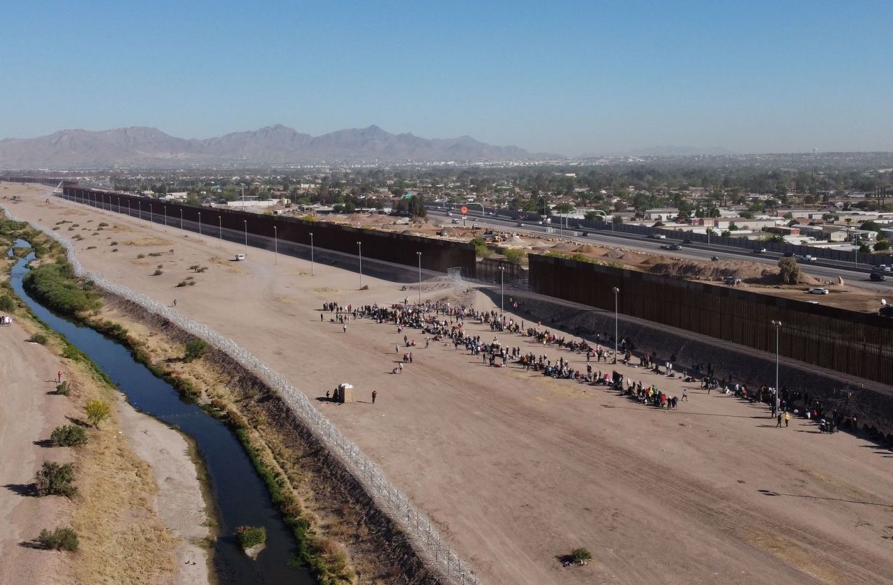 Migrants wait to be processed by US Border Patrol in El Paso, Texas, after crossing from Ciudad Juárez on May 10.
