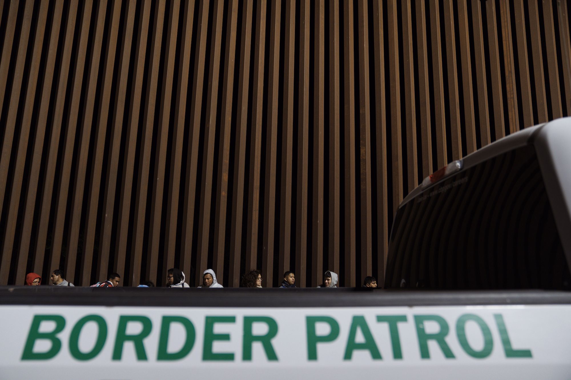 Migrants surrender to US Border Patrol agents after crossing the border in Yuma on May 10.