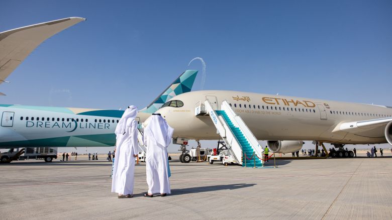 A Boeing 787-10 Dreamliner, left, and an Airbus A350-1000 passenger aircraft, operated by Etihad Airways, on display at the 17th Dubai Air Show (DAS) in Dubai, United Arab Emirates, on Monday, Nov. 15, 2021. On the first day of the Airshow, that will run through November 18, Emirates President Tim Clark said the Gulf carrier could look at accelerating deliveries of Airbus SE A350 jets if Boeing Co. fails to pin down delivery dates for the rival 777X model. Photographer: Christopher Pike/Bloomberg