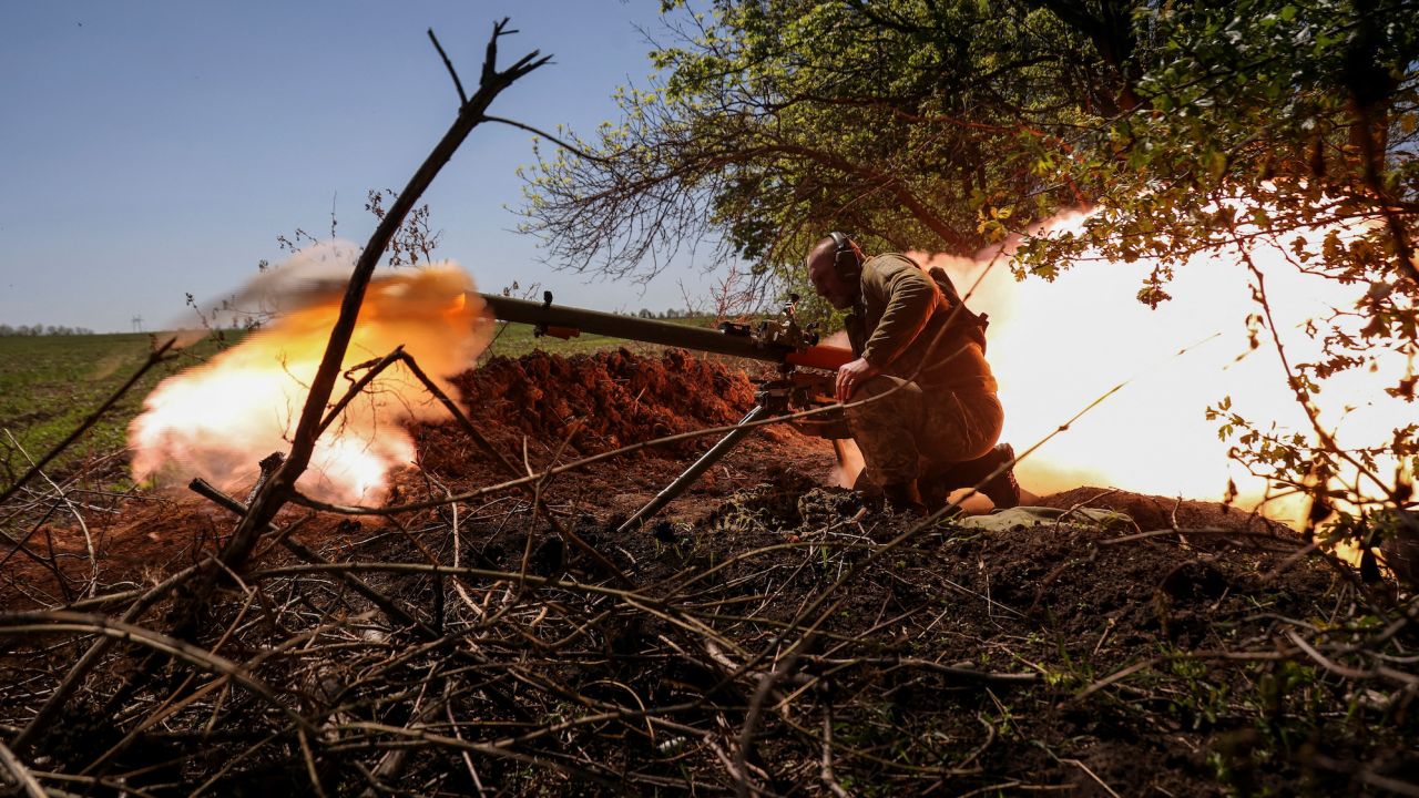 A Ukrainian service member fires an anti-tank grenade launcher at a front line near the city of Bakhmut, Ukraine on May 3, 2023.
