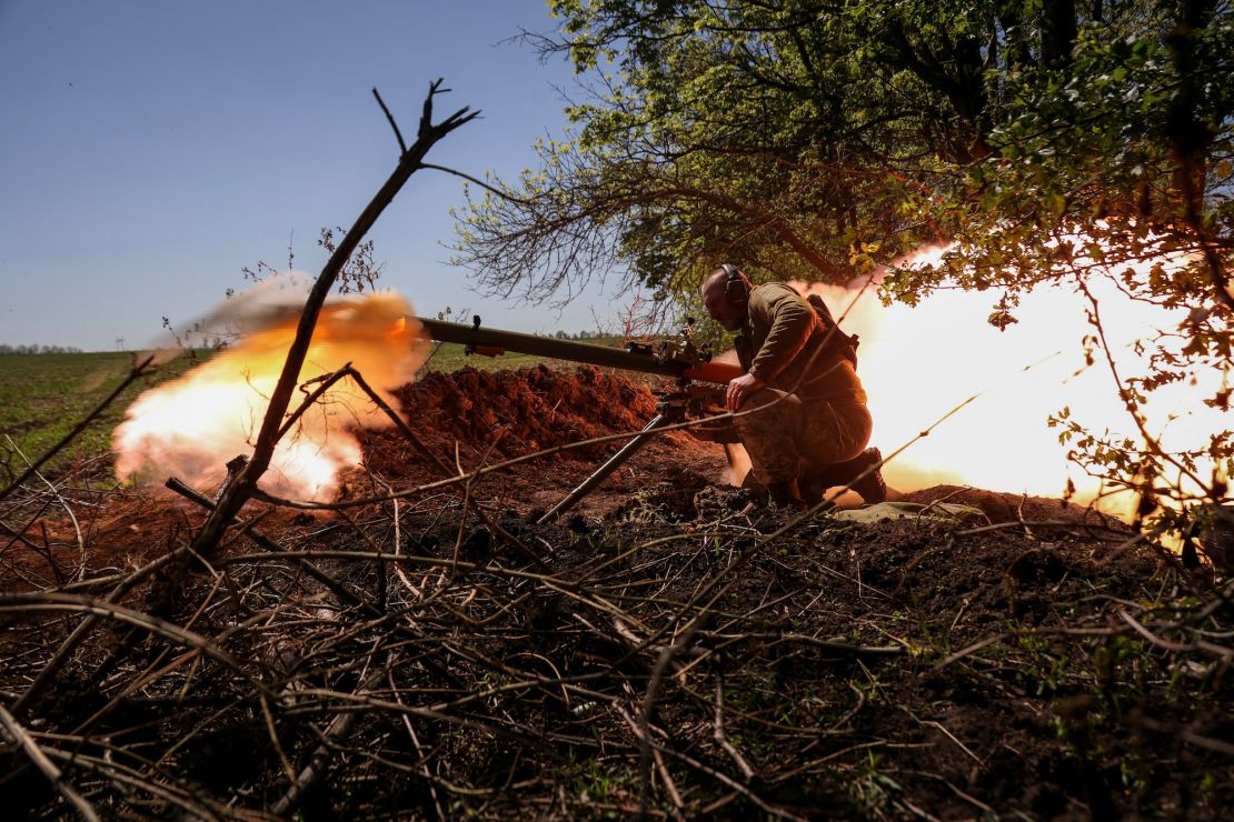 A Ukrainian service member fires an anti-tank grenade launcher at a front line near the city of Bakhmut, Ukraine on May 3, 2023.