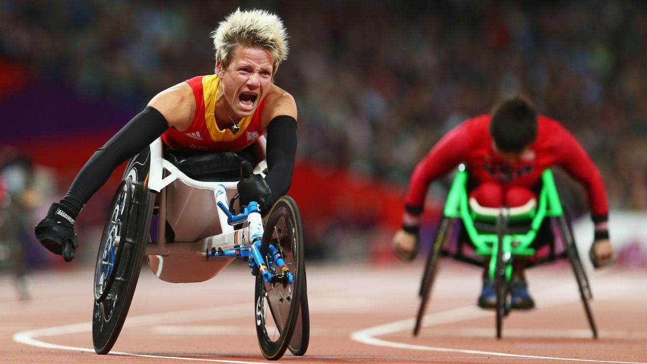 LONDON, ENGLAND - SEPTEMBER 05:  Marieke Vervoort of Belgium celebrates as she wins gold in the Women's 100m T52 Final on day 7 of the London 2012 Paralympic Games at Olympic Stadium on September 5, 2012 in London, England.