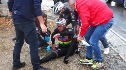 Soudal - Quick Step's Belgian rider Remco Evenepoel is assisted by members of his team after crashing during the fifth stage of the Giro d'Italia 2023 cycling race, 171 km between Atripalda and Salerno, on May 10, 2023. (Photo by Luca Bettini / AFP) (Photo by LUCA BETTINI/AFP via Getty Images)