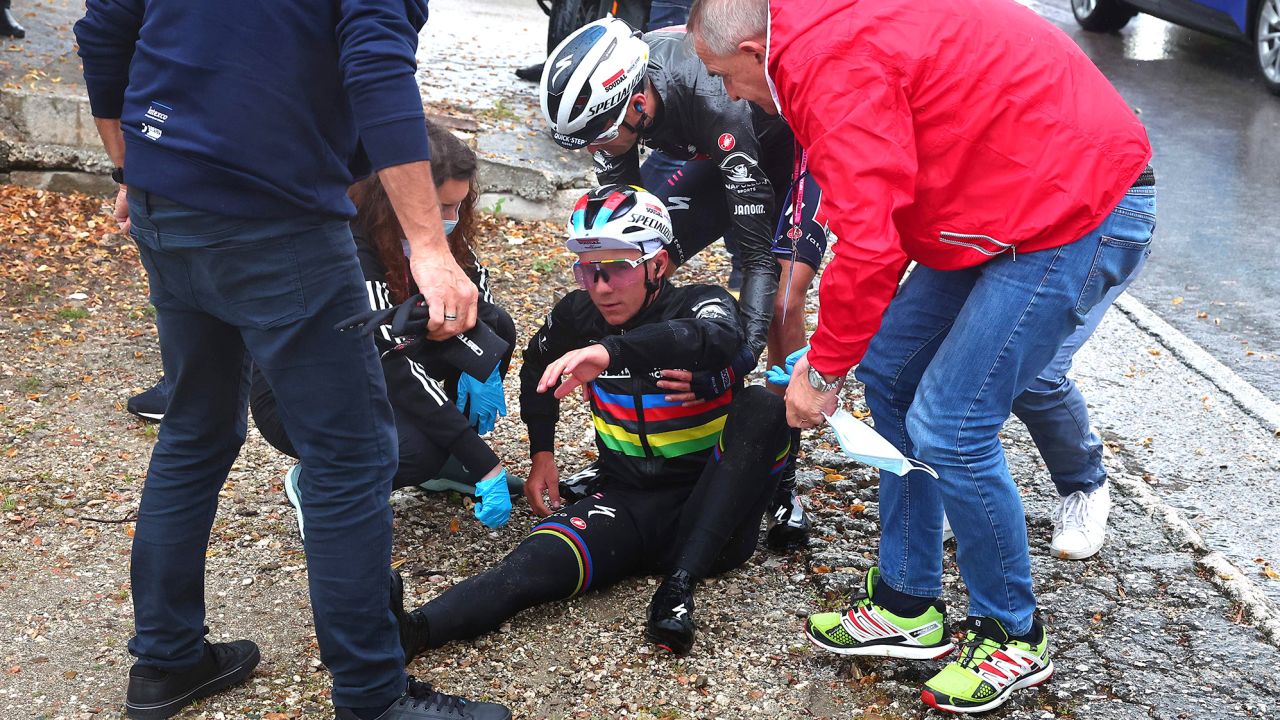 Remco Evenepoel is assisted by members of his team after crashing during the fifth stage of the Giro d'Italia.