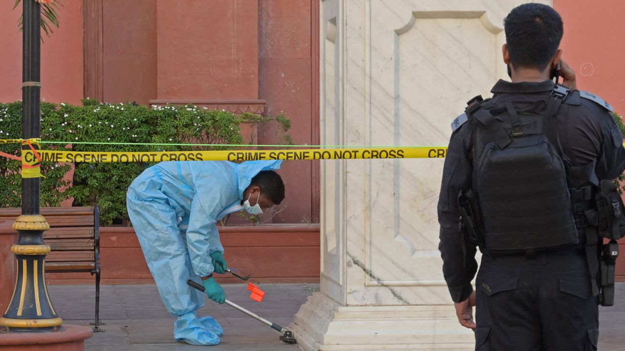 Members of India's National Security Guard inspect the site of an explosion on May 9, 2023, in Amritsar.